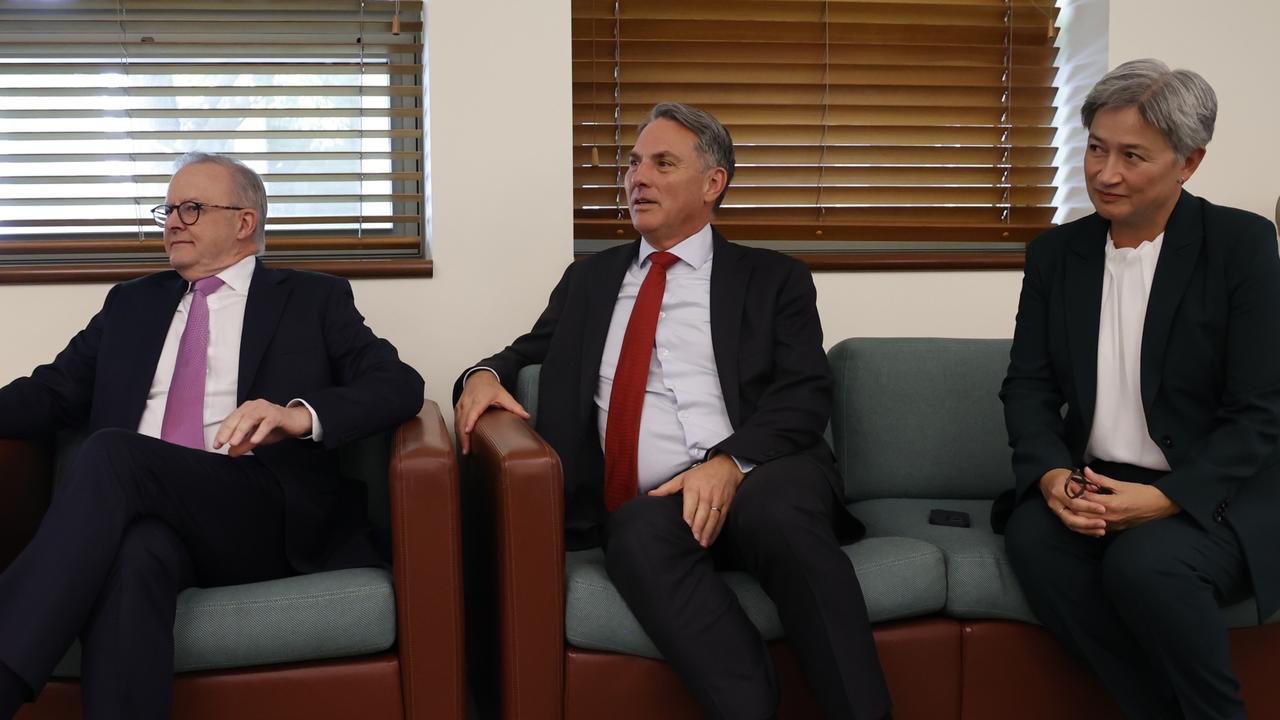 Richard Marles (c) and Penny Wong (R) will remain in their posts. Picture: Hilary Wardhaugh/Getty