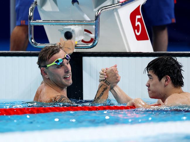 Zhanle Pan oand Kyle Chalmers shake hands after the freestyle final. Picture: Quinn Rooney/Getty Images