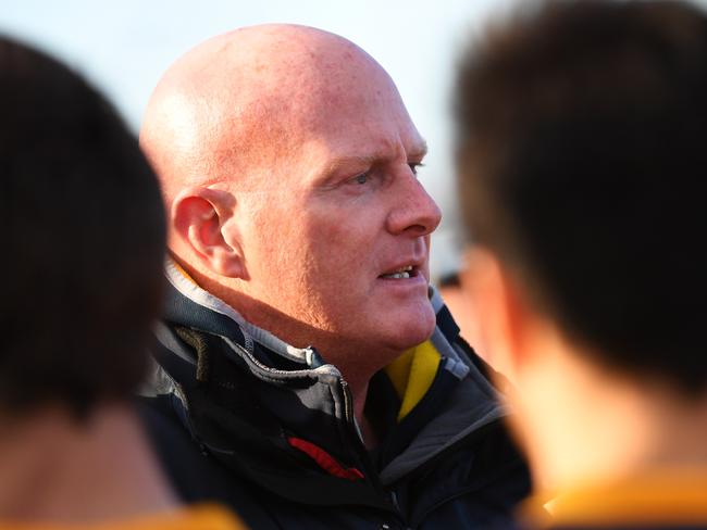 Essendon Doutta Stars Senior coach Dean Wallis addresses his pIayers  during 3/4 time tat he EDFL footy match at Buckley Park, Essendon, Melbourne, Saturday, July 14, 2018. Essendon Doutta Stars v West Coburg. (AAP Image/James Ross) NO ARCHIVING