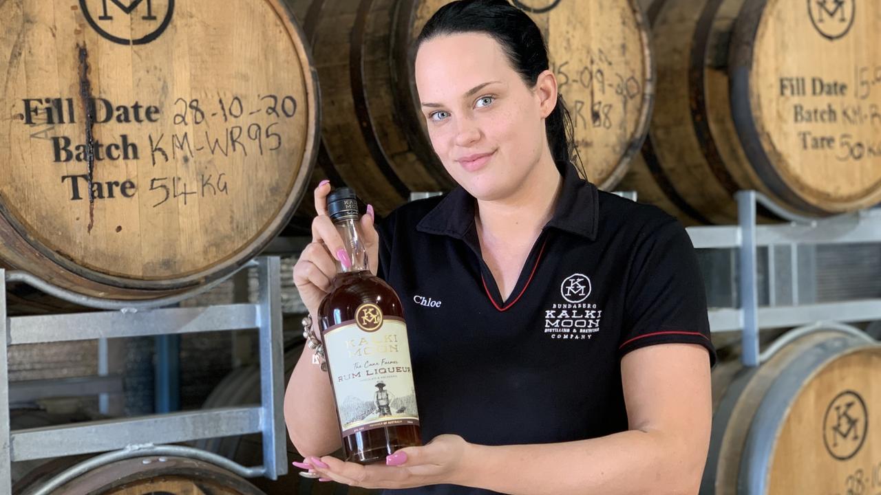 IN GOOD SPIRITS: Chloe Prosser with a bottle of the popular Kalki Moon Rum Liqueur.