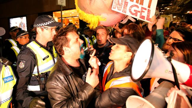 Police try to separate protesters and supporters. Picture: Stuart McEvoy