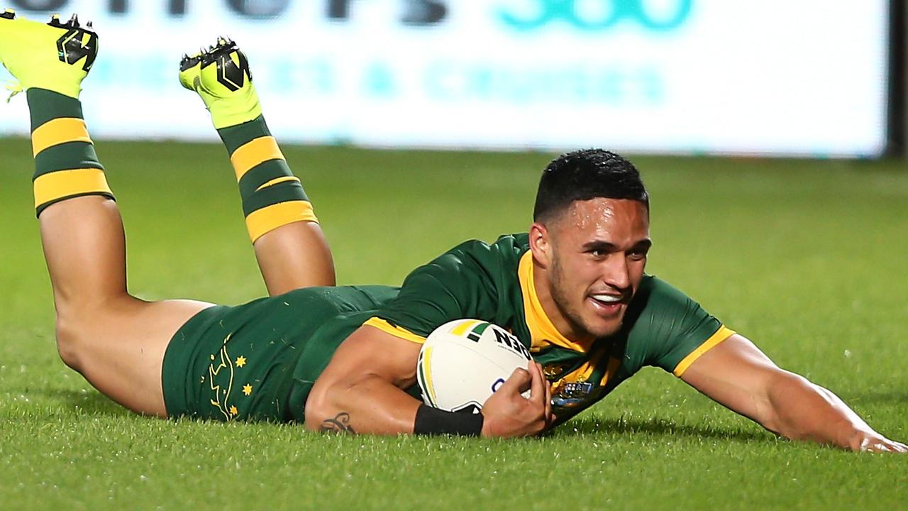 Valentine Holmes scores a try for Australia.