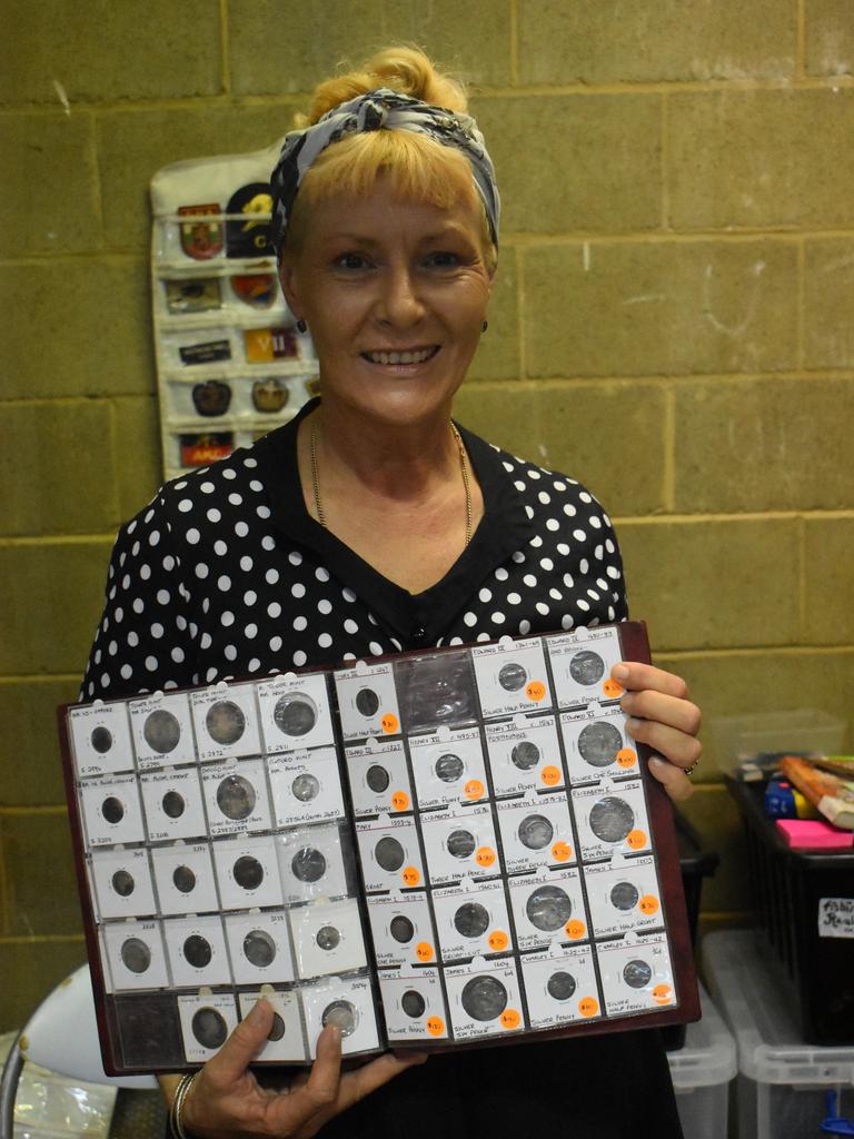 ANTIQUES: Linda Thomson from Port Macquarie displays antique coins for sale at the Fraser Coast Antique Collectable Fair. Photo: Stuart Fast