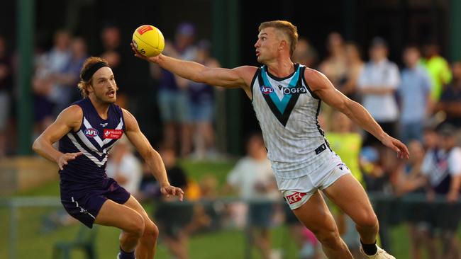 Ollie Wines of the Power reaches out for the ball during the AFL Practice Match between the Fremantle Dockers and the Port Adelaide Power at Fremantle Oval on March 02 Picture: James Worsfold/AFL Photos/via Getty Images