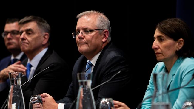 Scott Morrison is seen alongside Chief Medical Officer Brendan Murphy, second from left, and other state leaders during the COAG meeting in Sydney on Friday. Picture: AAP