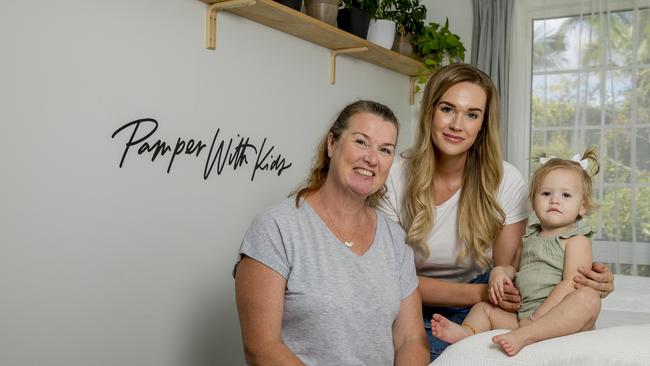 Hollie Durack and her mother Julie Nilsson have started Pamper with Kids, a business specialising in pampering mums and has an on site babysitter. Hollie Durak, her daughter Winter, 1, and Julie Nilsson. Picture: Jerad Williams