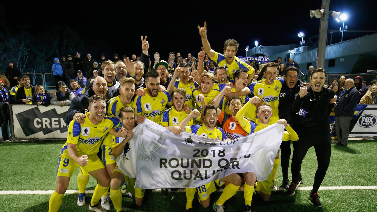 The Strikers celebrate winning their FFA Cup round of 32 match.