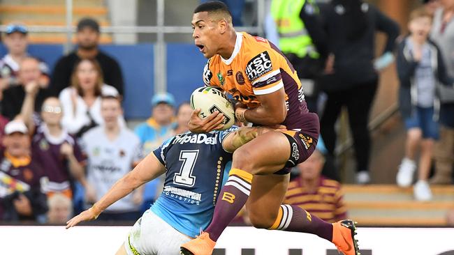 Jamayne Isaako of the Broncos competes for the high ball with Michael Gordon of the Titans. Photo: AAP