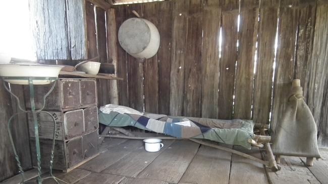 The inside of Kruger's Slab Hut at the Highfields Pioneer Village at Toowoomba shows living in the late 1800s.