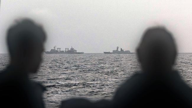 Sailors aboard HMAS Arunta monitor the People’s Liberation Army-Navy task group in the Tasman Sea. Picture: Defence