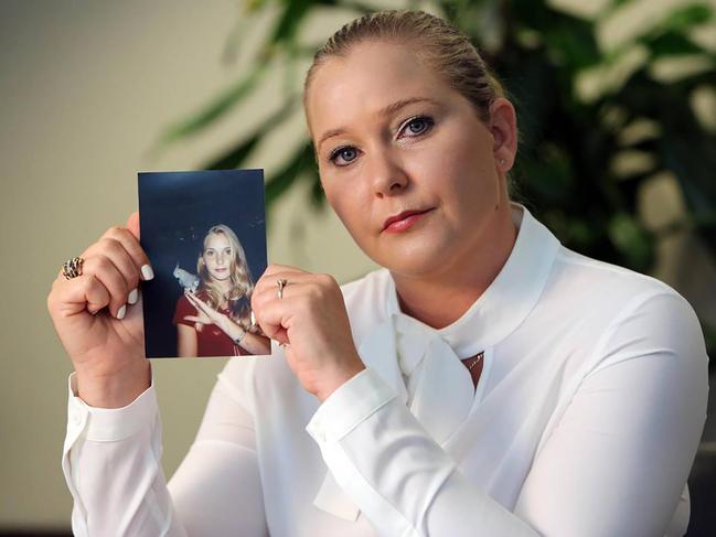 Virginia Roberts Giuffre, with a photo of herself as a teen, when she says she was abused by Jeffrey Epstein, Ghislaine Maxwell and Prince Andrew, among others. (Emily Michot/Miami Herald/Tribune News Service via Getty Images)
