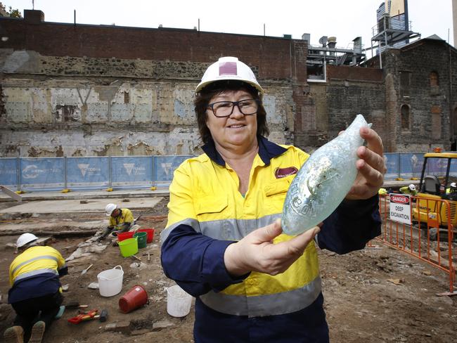 Excavation director Meg Goulding holds a rare torpedo bottle popular in Melbourne in the early 1900s. Picture: David Caird