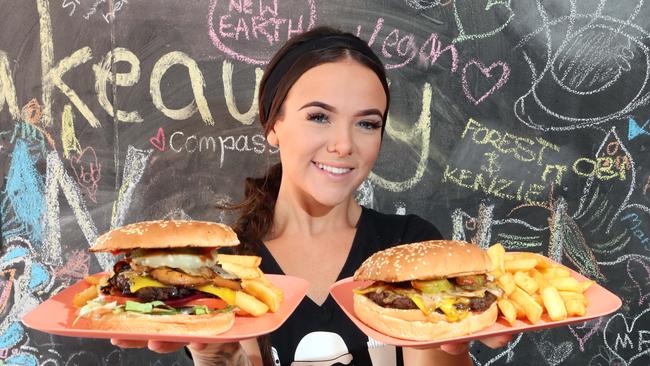 Brittany Partridge with a burger with the lot and a cheese burger. Picture: Richard Gosling