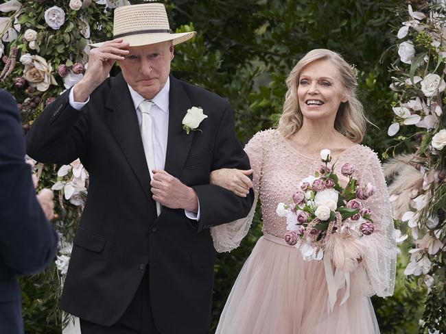 Alf (Ray Meagher) and Martha (Belinda Giblin) walk down the aisle.