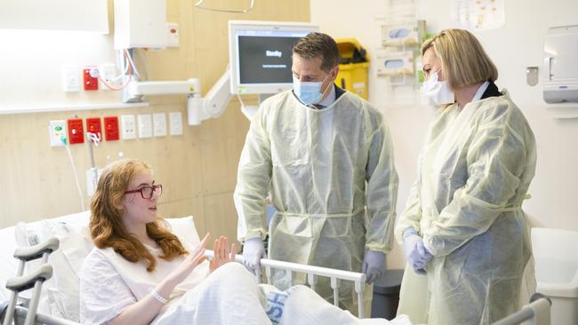 SYDNEY, AUSTRALIA - NCA NewsWire - 15 MAY, 2024: NSW Health Minister Ryan Park, Marjorie O’Neill and patient Amy inside Sydney Children's Hospital. The two Health workers are Elizabeth and Freya (both Nurse Unit Managers). 'Amy (14) was diagnosed with Adamantinoma, a particularly rare, cancerous tumour that starts in bones in 2021. Amy had 23cm of bone removed from her tibia and has been undergoing bone and skin grafting in her leg. Last Thursday, Amy underwent her 21st surgery to have another bone graft and is recovering well, hoping to be home by the weekend.' Picture: NCA NewsWire