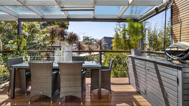 A deck, accessed via the rear kitchen and dining area, leads to a landscaped garden on the 240 sqm block. Picture: realestate.com.au