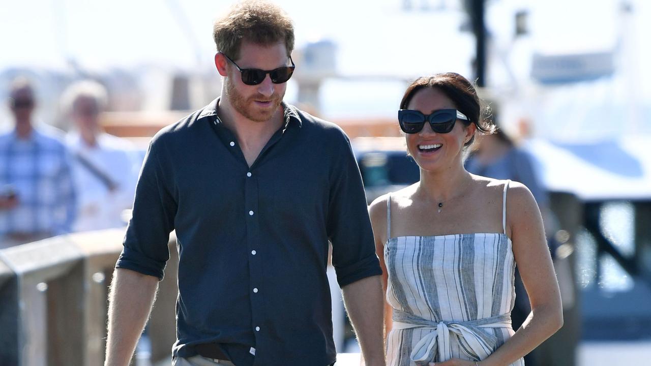 Prince Harry and Meghan, the Duchess of Sussex walk to attend a meet-the-people session at Kingfisher Bay Resort on Fraser Island in October 2018. Picture: Darren England/AFP