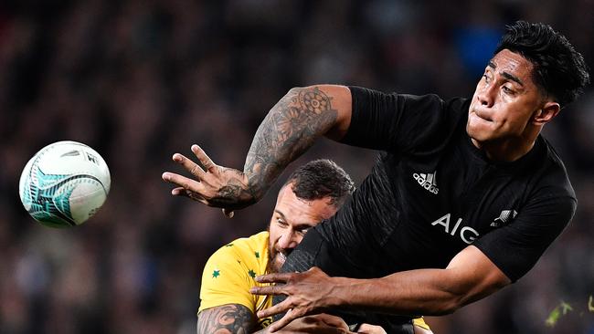 Malakai Fekitoa of the All Blacks offloads the ball during a Bledisloe Cup Test in 2016.
