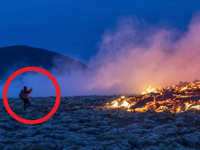 Pics show tourists standing metres from lava