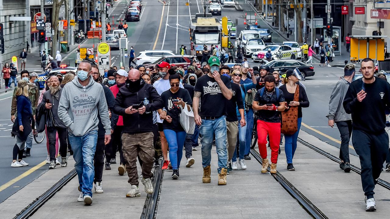 Protesters march through Melbourne's CBD. Picture: Jake Nowakowski