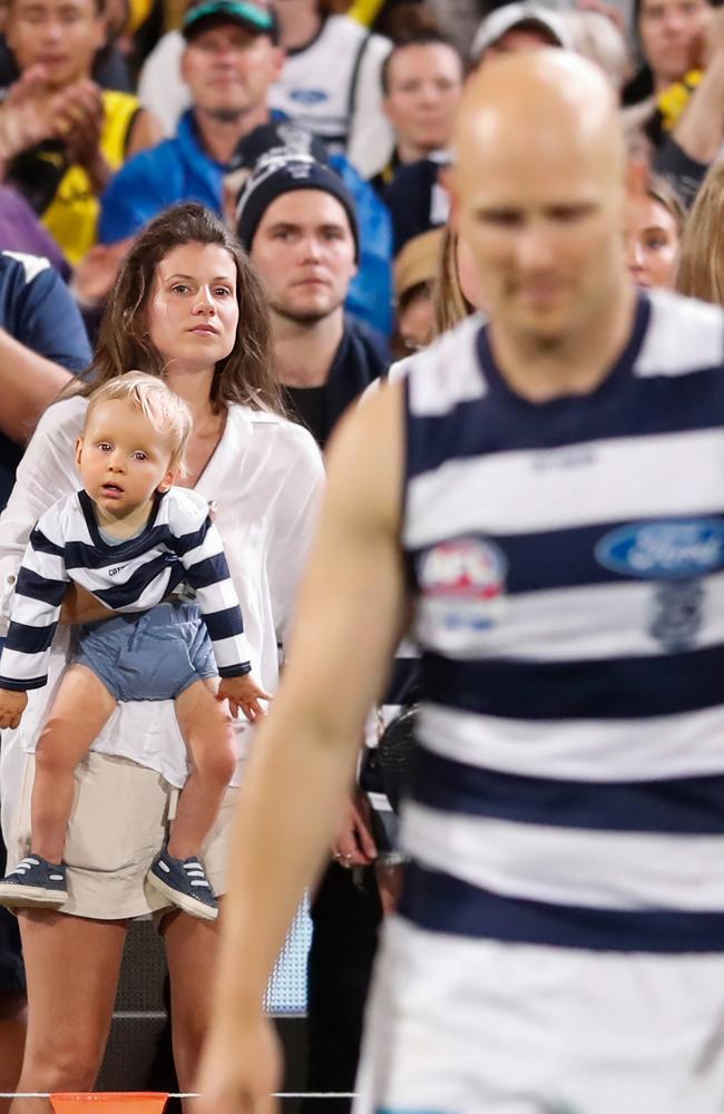 Jordan Ablett and Levi watching Gary on field. Picture: Michael Willson