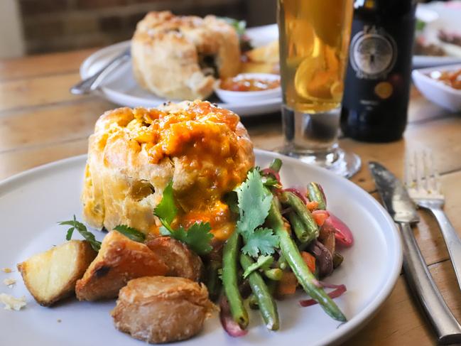 Alapaca meat pie from The Glass Cafe with Eden Brewery beer. Picture: Jenifer Jagielski