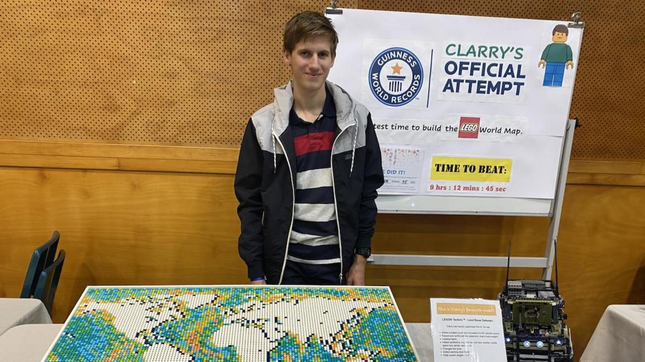 Clarry Farkash stands next to his completed Lego world map after beating the previous Guinness World Record by two hours. Clarry completed the map in 7 hours, 9 minutes and 41 seconds. He has waited seven months for the final verdict after he lost a single piece and had to restart. Picture: Supplied