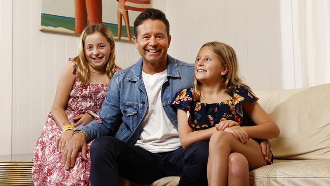 Stevie Jacobs with his daughters Isabella, 11, (left) and Francesca, 9, at home in Bondi. Picture: Jonathan Ng