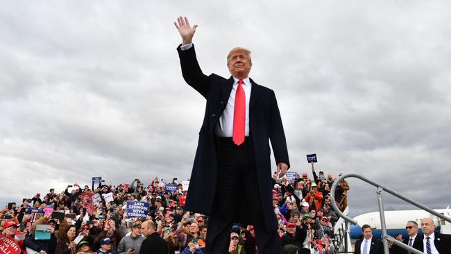 TOPSHOT - US President Donald Trump arrives for a "Make America Great Again" rally at Bozeman Yellowstone International Airport, November 3, 2018 in Belgrade, Montana. - With rallies in Montana and Florida, a state he had already visited on Wednesday, Trump on Saturday is keeping up his relentless campaign schedule before Tuesday's ballot, which has become a referendum on his unconventional presidency. (Photo by Nicholas Kamm / AFP)