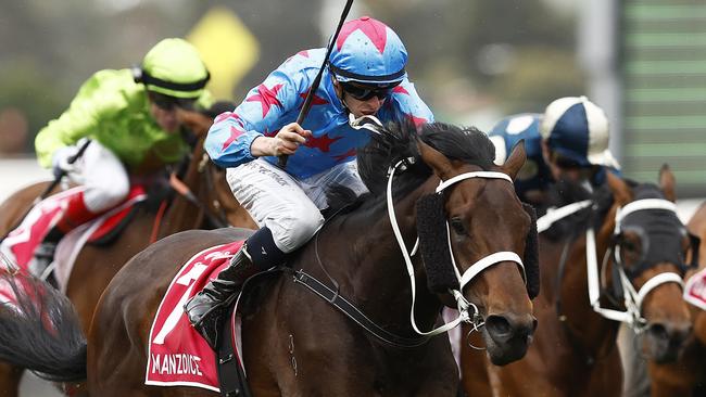 Michael Dee riding Manzoice to victory in the Victoria Derby. Picture: Daniel Pockett-Getty Images