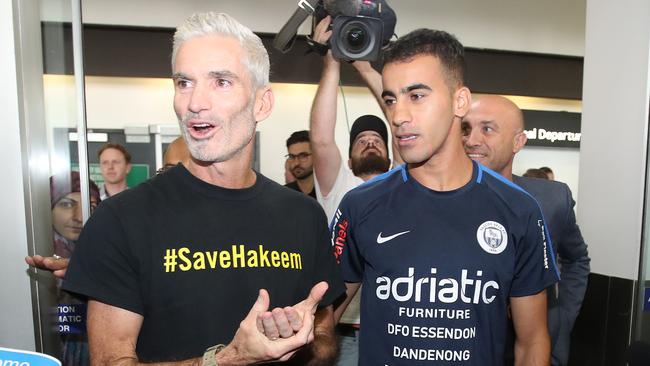 Refugee Bahraini footballer Hakeem al-Araibi, right, with Craig Foster at Melbourne Airport yesterday. Picture: Getty Images