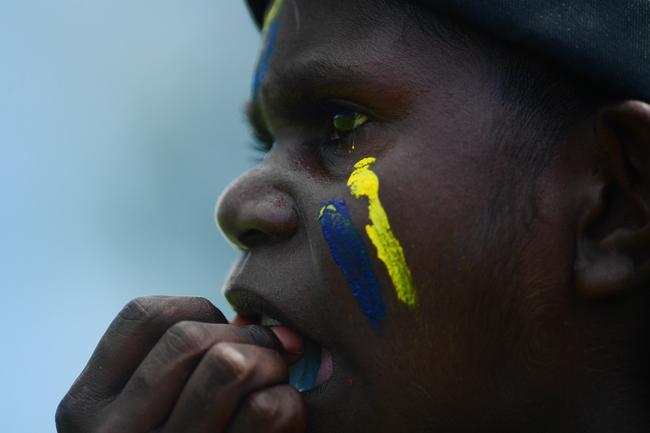 A Ranku Eagles supporter watches intently as his squad takes on the Tapalinga Superstars during this year's 49th Annual Tiwi Grand Final on Bathurst Island, 80km's north of Darwin, NT. Picture: Justin Kennedy