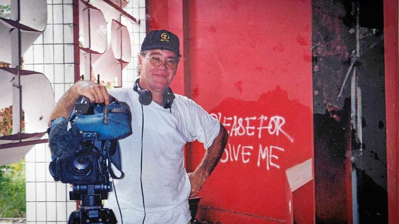 Taken in 2000 when Glen was covering a Timor dispute in a burnt out Government office complex. Picture: Contributed