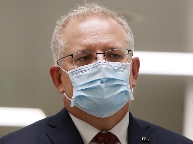 SYDNEY, AUSTRALIA - AUGUST 19: Prime Minister Scott Morrison is seen wearing a face mask during a press conference at AstraZeneca on August 19, 2020 in Sydney, Australia.  The Australian government has announced an agreement with the British pharmaceutical giant AstraZeneca to secure at least 25 million doses of a COVID-19 vaccine if it passes clinical trials.  The University of Oxford COVID-19 vaccine is currently in phase-three testing. If the vaccine proves to be successful, Australia will manufacture and supply vaccines and will be made available for free. The project could deliver the first vaccines by the end of this year or by early 2021. (Photo by Lisa Maree Williams/Getty Images)