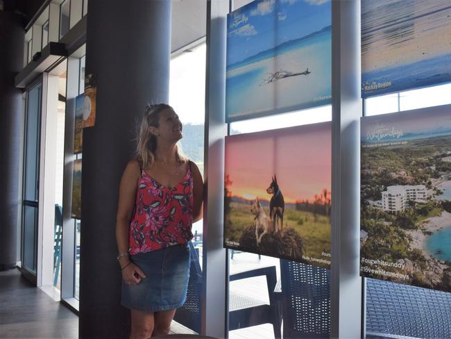 Tour guide Cherene Poidevin with her picture of Whitehaven Beach, which is now on display as part of the Tourism Whitsundays Let's Get Together campaign. Picture: Laura Thomas