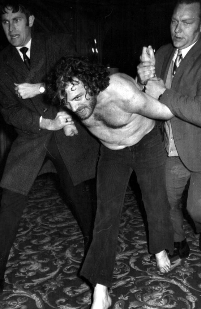 October 1972: Detectives arrest singer Joe Cocker, who was charged over an alleged drunken brawl with police and security staff at his Melbourne hotel room. Picture: News Limited