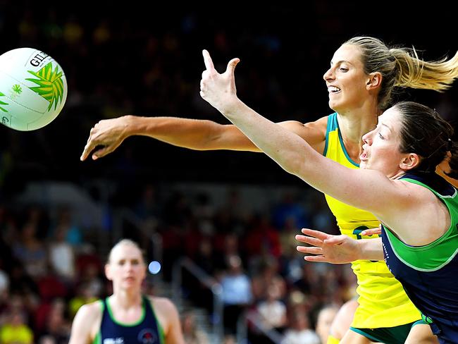 Australia’s Laura Geitz and Oonagh McCullough of Northern Ireland compete for the ball during the Diamonds’ dominate victory in their opening match. Picture: Getty Images