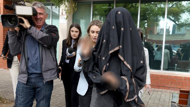 A 14-year-old girl leaves the Adelaide youth court on April 12 after facing court on charges of possessing explosive instructions and extremist material Picture: NCA NewsWire / Kelly Barnes