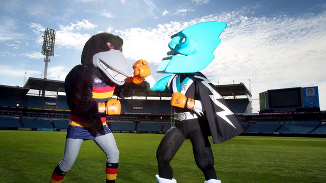 Port Power’s Mascot (right) fighting with fierce rival the Adelaide crow.