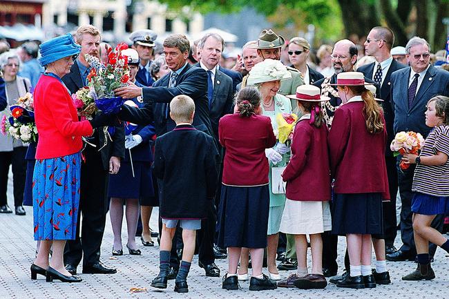 Queen Elizabeth II surrounded by schoolchildren in Hobart’s Salamanca Place in 2000.