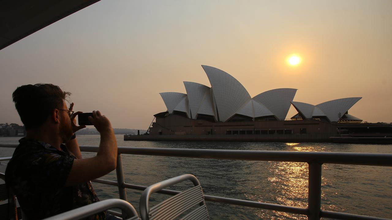 The Sydney Opera House as seen from the Manly Ferry during a day when the city could see 41C. Picture: AAP Image/Steven Saphore.