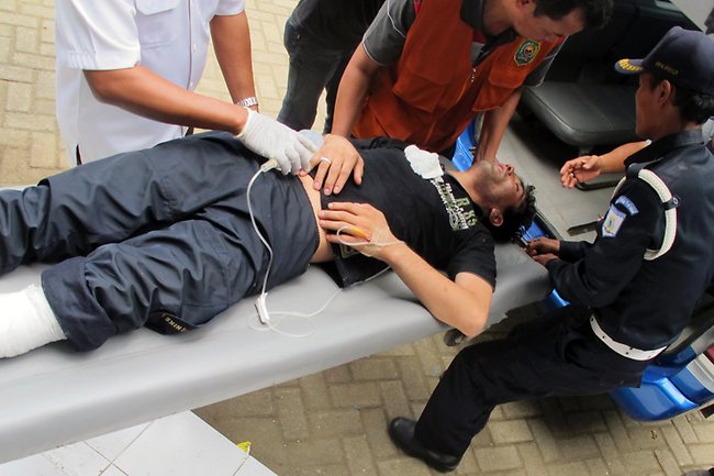 <p>Survivors of the Indonesian boat tragedy. Picture: AP</p>