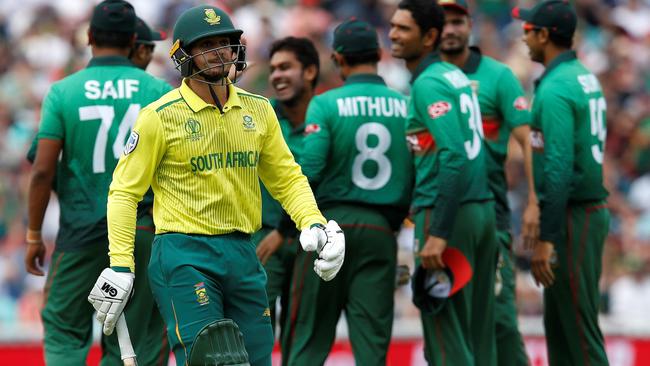 South Africa's Quinton de Kock walks back to the pavilion after his farcical run out.