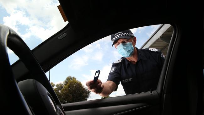 Sen Sgt Craig Stevens with a drug testing kit. Picture: Alison Wynd