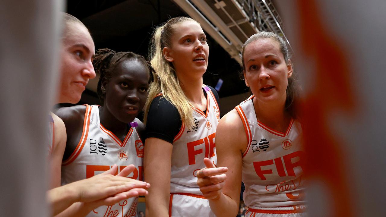 GEELONG, AUSTRALIA - OCTOBER 30: Townsville players celebrate the win during the round one WNBL match between Geelong United and Townsville Fire at The Geelong Arena, on October 30, 2024, in Geelong, Australia. (Photo by Kelly Defina/Getty Images)