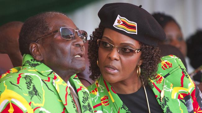 Zimbabwean President Robert Mugabe, left, and his wife Grace in June.