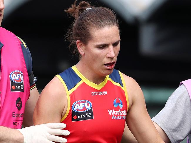 ADELAIDE, AUSTRALIA - APRIL 10: Chelsea Randall of the Crows is attended to after a collision with Eliza McNamara of the Demons during the 2021 AFLW First Preliminary Final match between the Adelaide Crows and the Melbourne Demons at Adelaide Oval on April 10, 2021 in Adelaide, Australia. (Photo by Sarah Reed/AFL Photos via Getty Images)