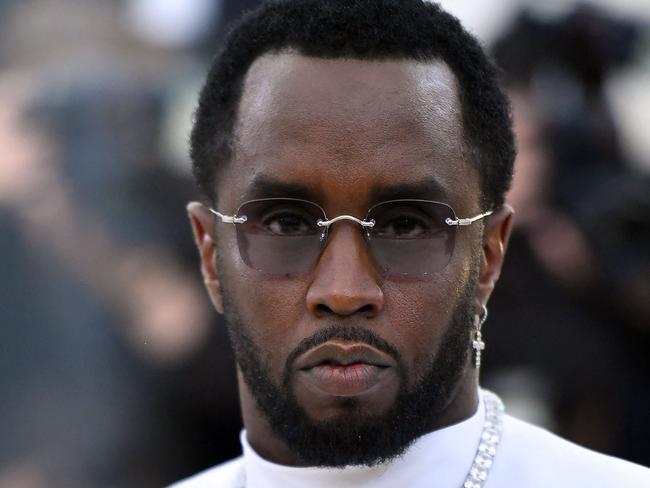 (FILES) Sean Combs 'P. Diddy' arrives for the 2018 Met Gala on May 7, 2018, at the Metropolitan Museum of Art in New York. Music mogul Sean Combs is set to go on trial for racketeering and sex trafficking on May 5, 2025, a judge said in a court hearing October 10, 2024. The rapper known as "Diddy" will remain incarcerated, said federal judge Arun Subramanian, after he was indicted last month on three criminal counts that allege he sexually abused women and coerced them into drug-fueled sex parties using threats and violence. (Photo by ANGELA WEISS / AFP)