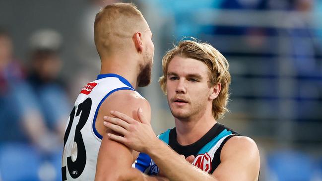 HOBART, AUSTRALIA - MAY 13: Ben McKay of the Kangaroos and Jason Horne-Francis of the Power shake hands after the siren during the 2023 AFL Round 09 match between the North Melbourne Kangaroos and the Port Adelaide Power at Blundstone Arena on May 13, 2023 in Hobart, Australia. (Photo by Dylan Burns/AFL Photos via Getty Images)