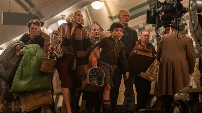 Elliott Heffernan as George, centre, Saoirse Ronan, left, as his mother, Paul Weller as his grandfather, right, in wartime devastated London in Blitz.